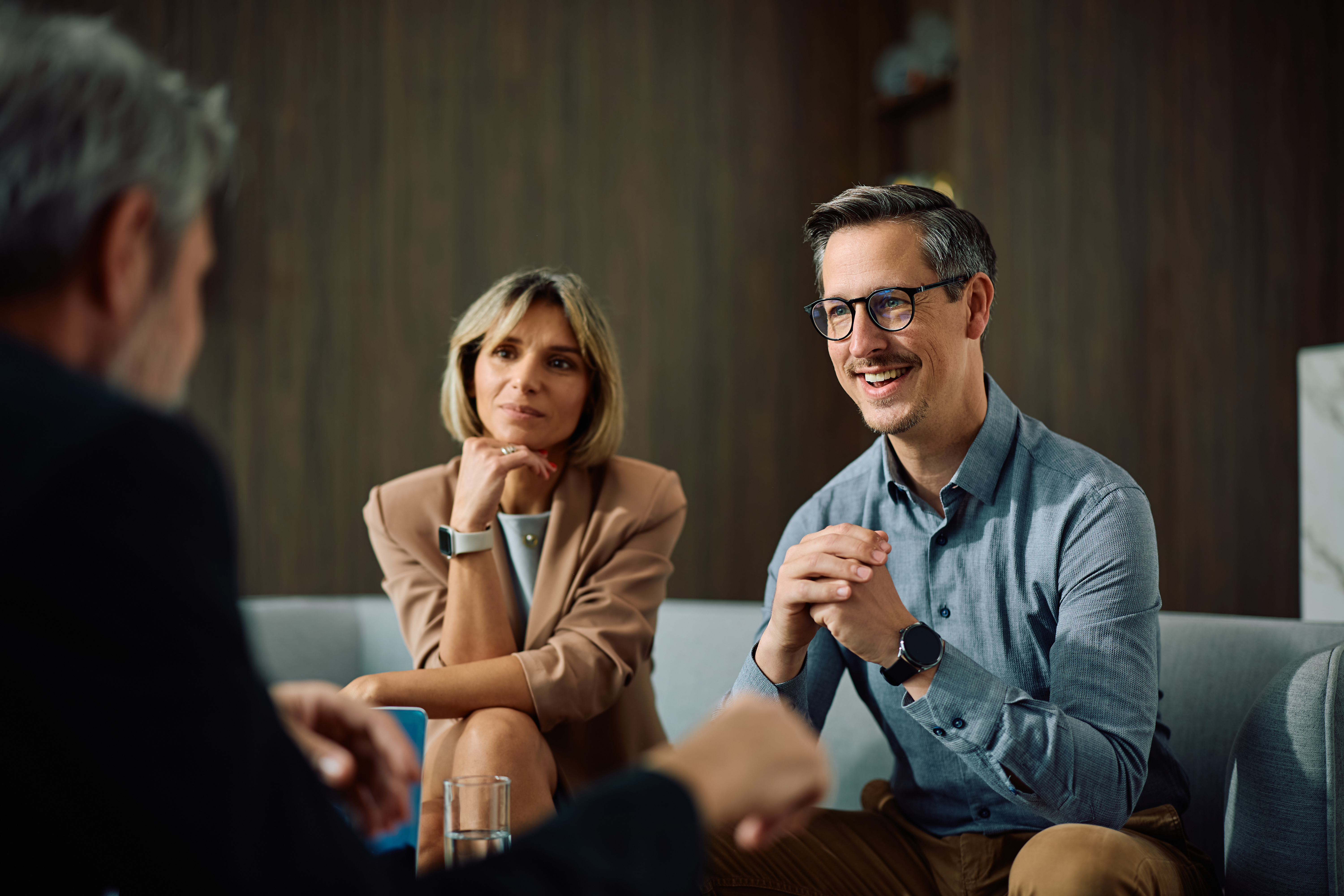 Business owners sitting in a meeting with an AI Consultant