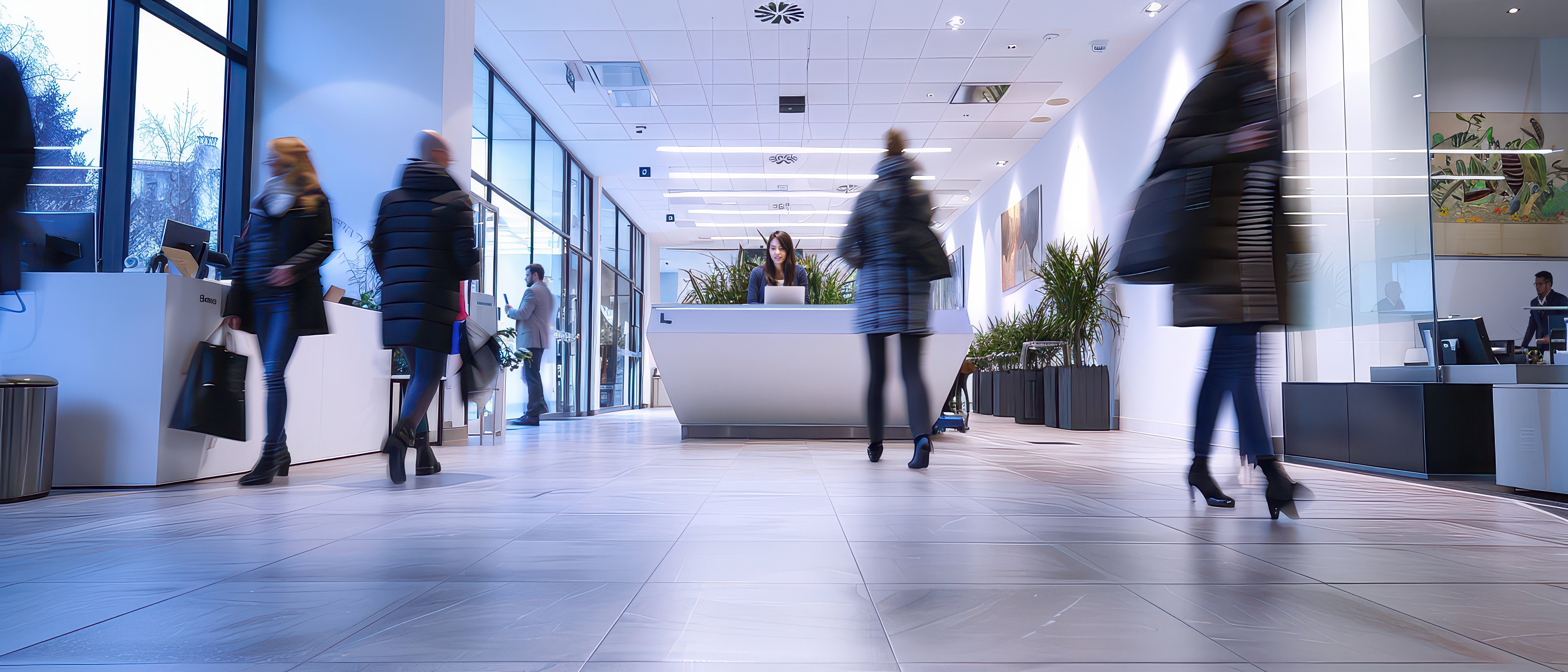Wide angle shot of people moving inside a bank, showing client activity